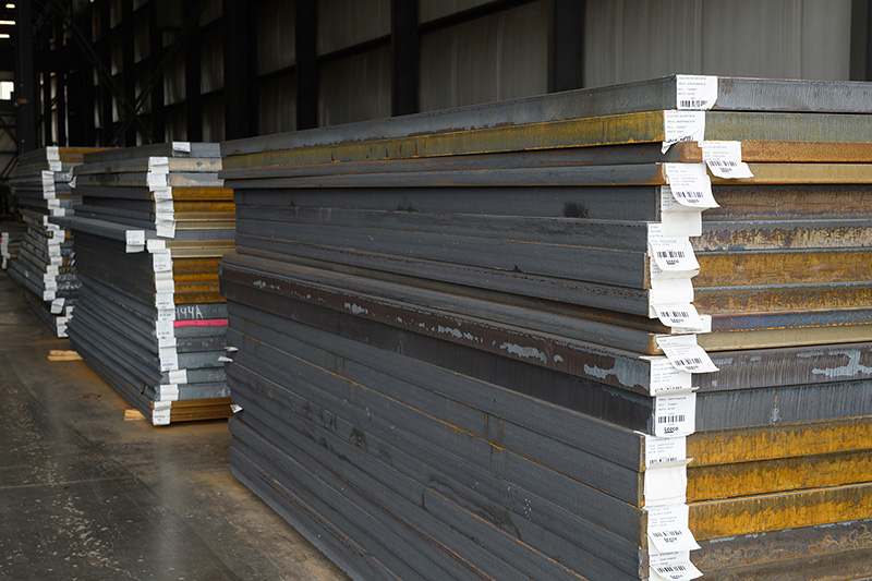 a stack of steel plate in a warehouse